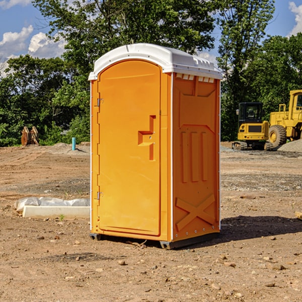 what is the cost difference between standard and deluxe porta potty rentals in Domino